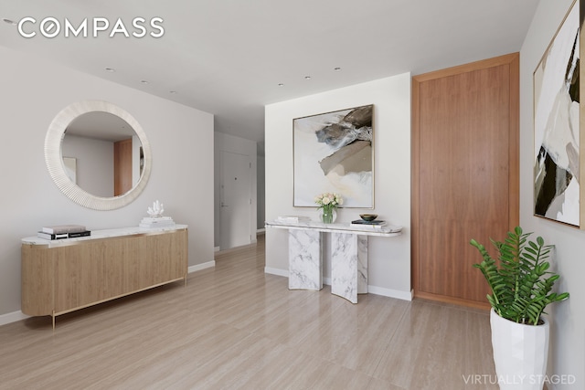 303 E 57th St Unit 33Ef, New York City, NY 10022 - bathroom featuring wood finished floors, baseboards, and vanity