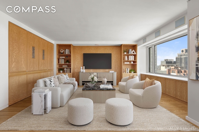303 E 57th St Unit 33Ef, New York City, NY 10022 - living area with light wood-type flooring and built in features