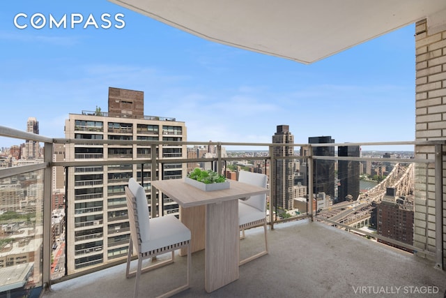 303 E 57th St Unit 33Ef, New York City, NY 10022 - balcony featuring a city view and outdoor dining area