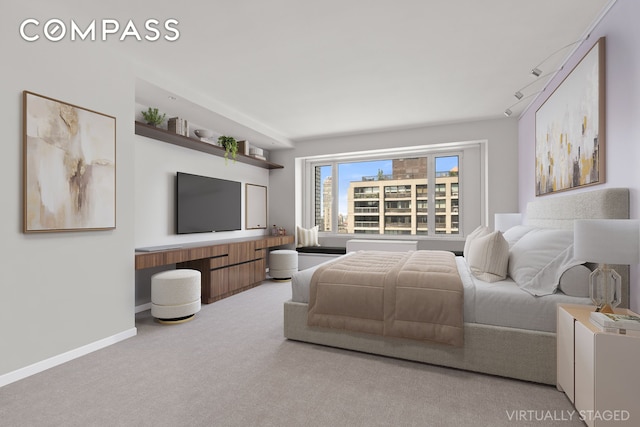 303 E 57th St Unit 33Ef, New York City, NY 10022 - bedroom featuring carpet flooring and baseboards