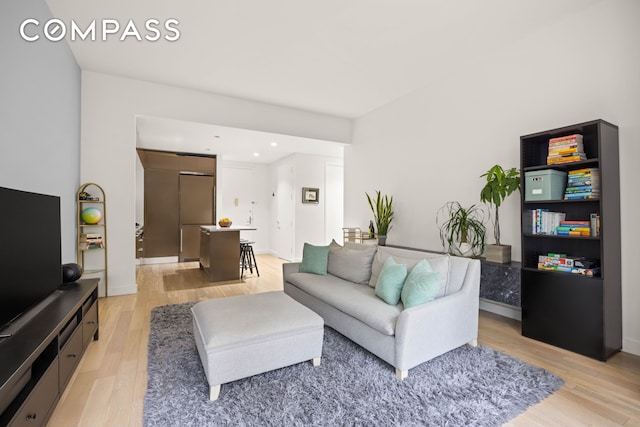 75 Wall St Unit 25K, New York City, NY 10005 - living room with light wood-style floors and recessed lighting