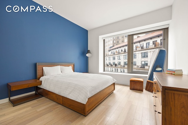 75 Wall St Unit 25K, New York City, NY 10005 - bedroom featuring light wood finished floors