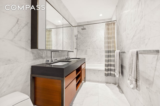 75 Wall St Unit 25K, New York City, NY 10005 - full bath featuring tile walls, tiled shower / bath combo, double vanity, and recessed lighting