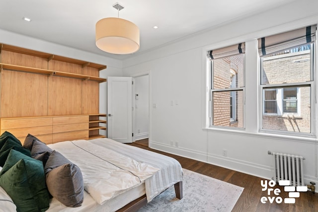 87 Columbia Hts Unit 56, New York City, NY 11201 - bedroom with radiator, wood finished floors, and baseboards