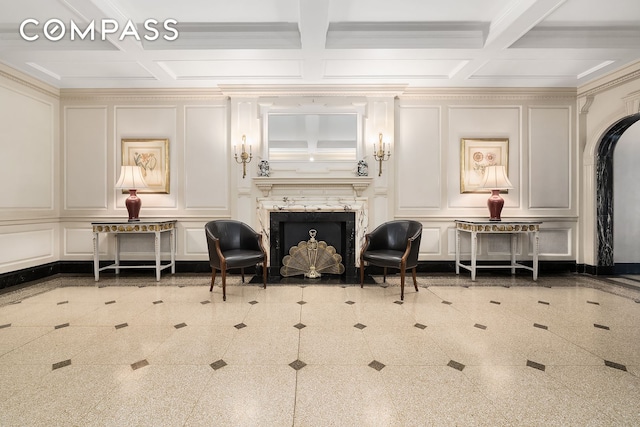 45 Christopher St Unit 12/14F, New York City, NY 10014 - sitting room with a decorative wall, coffered ceiling, a premium fireplace, beam ceiling, and crown molding