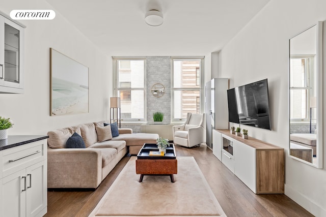 25 Broad St Unit 6M, New York City, NY 10004 - living room with wood finished floors