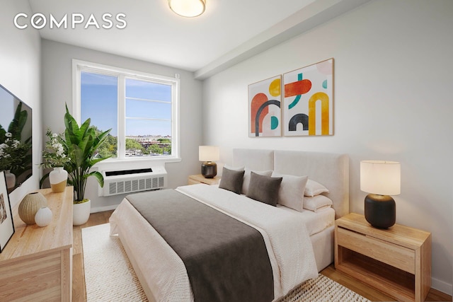 195 Hawthorne St Unit 5E, New York City, NY 11225 - bedroom featuring wood finished floors, a wall unit AC, and baseboards