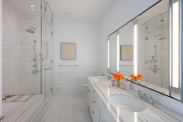 30 Park Pl Unit 64B, New York City, NY 10007 - bathroom with a shower stall, double vanity, and tile walls