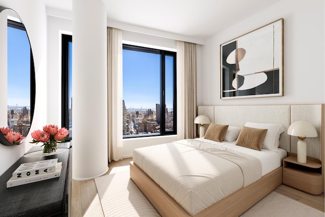 30 Front St Unit 28C, New York City, NY 11201 - bedroom with wood finished floors and a view of city