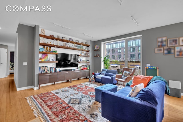 40 W 116th St Unit A907, New York City, NY 10026 - living room featuring track lighting and light wood-type flooring