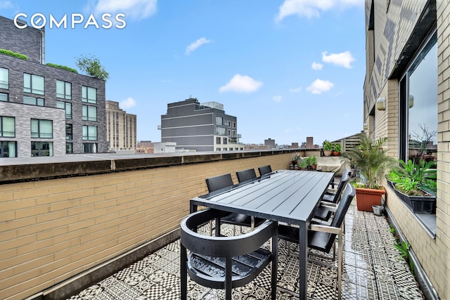 40 W 116th St Unit A907, New York City, NY 10026 - view of patio featuring outdoor dining space and a view of city