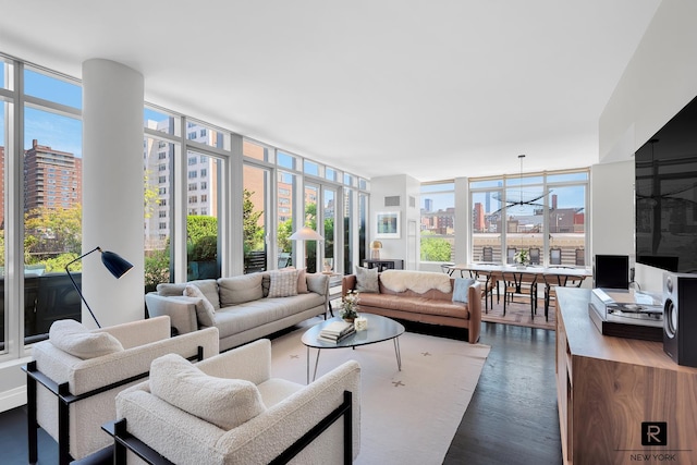 177 9th Ave Ph-F, Ph-F New York City, NY 10011 - living area featuring a city view, floor to ceiling windows, and dark wood-style flooring