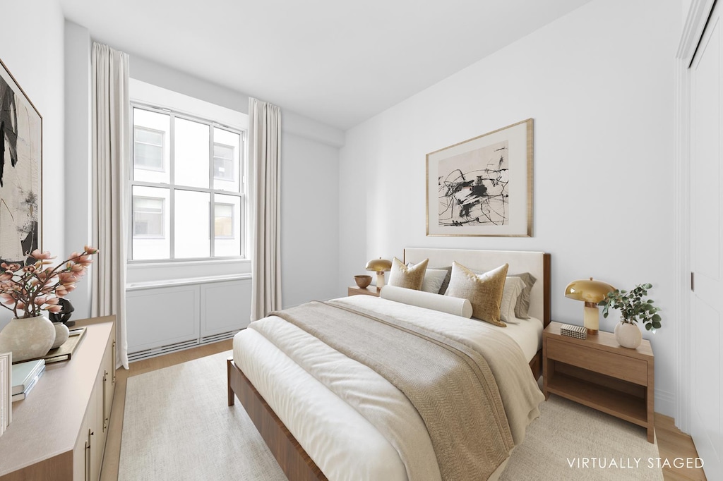 1 Wall St Unit 932, New York City, NY 10005 - bedroom featuring light wood-style floors