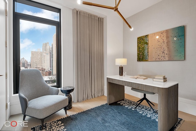 310 E 86th St Unit 14B, New York City, NY 10028 - office space featuring light wood-type flooring and a skyline view
