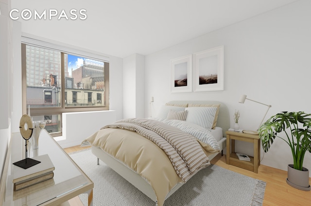 242 E 25th St Unit 5B, New York City, NY 10010 - bedroom with wood finished floors