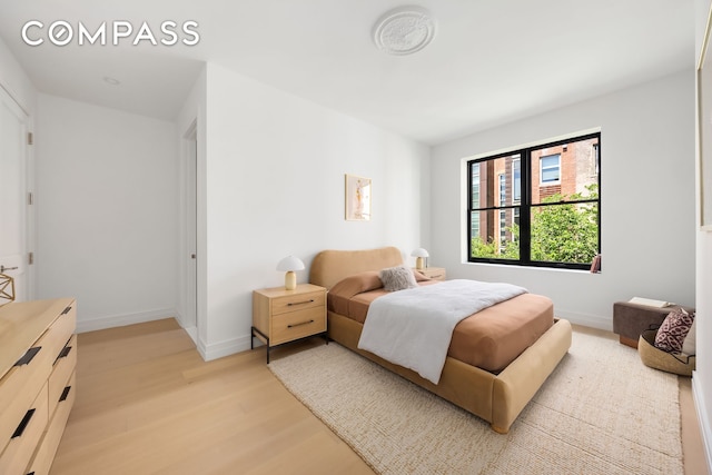 53 W 85th St, New York City, NY 10024 - bedroom with light wood-type flooring and baseboards