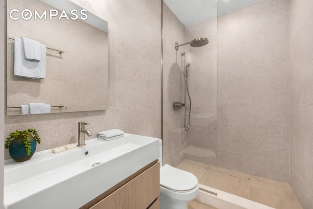 53 W 85th St, New York City, NY 10024 - bathroom with a walk in shower, toilet, vanity, and tile walls
