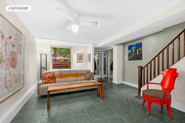 704 Humboldt St, New York City, NY 11222 - living area with stairway, ceiling fan, and dark tile patterned flooring