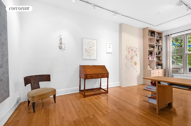 704 Humboldt St, New York City, NY 11222 - home office with track lighting and wood finished floors