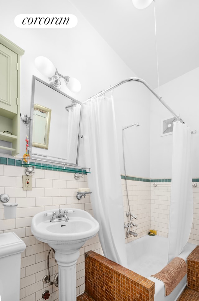 704 Humboldt St, New York City, NY 11222 - bathroom with shower / bath combination with curtain and tile walls
