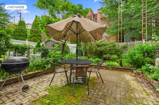 704 Humboldt St, New York City, NY 11222 - fenced backyard featuring a patio area and outdoor dining area