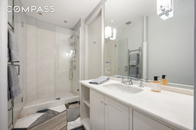 32 W 20th St Unit 5, New York City, NY 10011 - bathroom featuring a shower stall and vanity