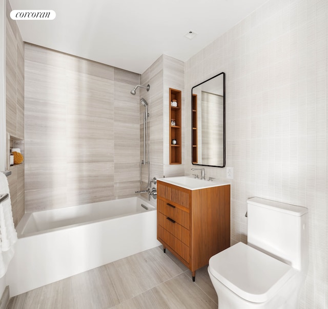 428 W 19th St Unit 2C, New York City, NY 10011 - bathroom featuring tile walls, bathing tub / shower combination, toilet, and vanity