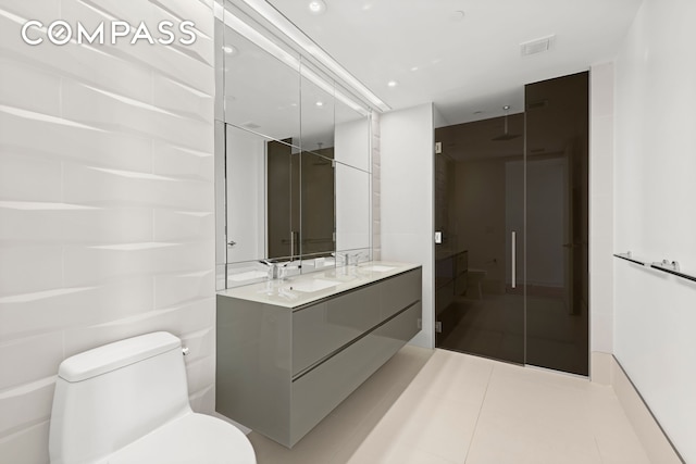 400 Park Ave S Unit 28C, New York City, NY 10016 - full bath with double vanity, a stall shower, toilet, recessed lighting, and tile patterned flooring
