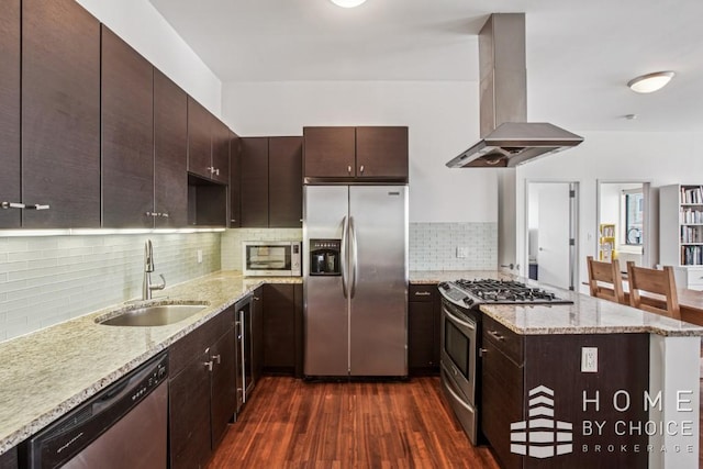 1610 Dekalb Ave Unit 5A, New York City, NY 11237 - kitchen featuring appliances with stainless steel finishes, island exhaust hood, a sink, dark wood-type flooring, and tasteful backsplash