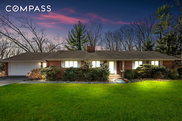420 Ocean Ter, New York City, NY 10301 - ranch-style home with an attached garage, driveway, brick siding, a front lawn, and a chimney