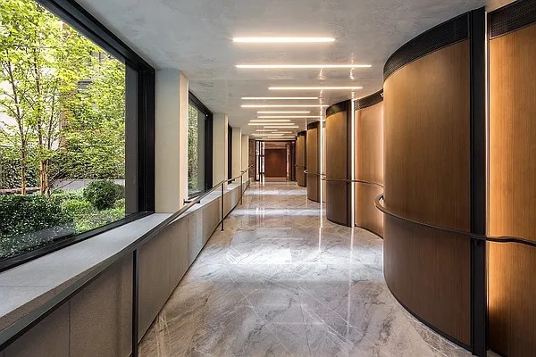 70 Charlton St Unit 4F, New York City, NY 10014 - corridor featuring light marble finish flooring
