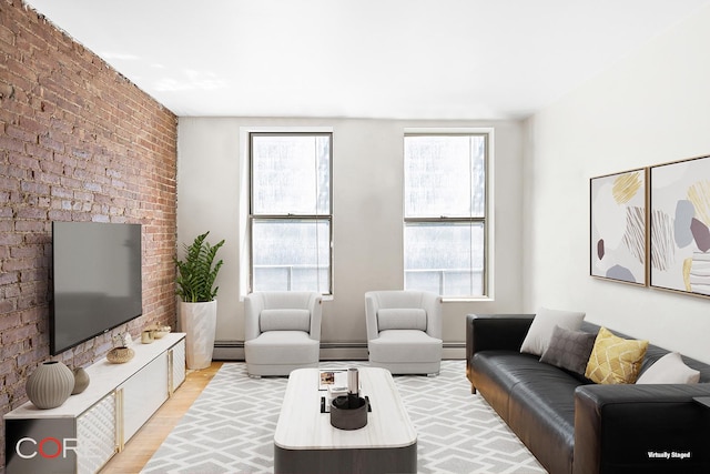 105 E 100th St Unit 4A, New York City, NY 10029 - living area with a baseboard heating unit, brick wall, and light wood-style floors