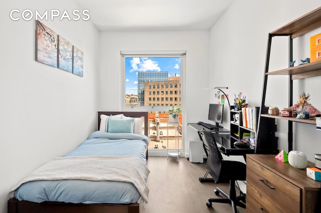 371 W 123rd St Unit 8A, New York City, NY 10027 - bedroom featuring wood finished floors and an office area