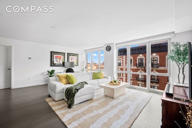 371 W 123rd St Unit 8A, New York City, NY 10027 - living room featuring wood finished floors and baseboards