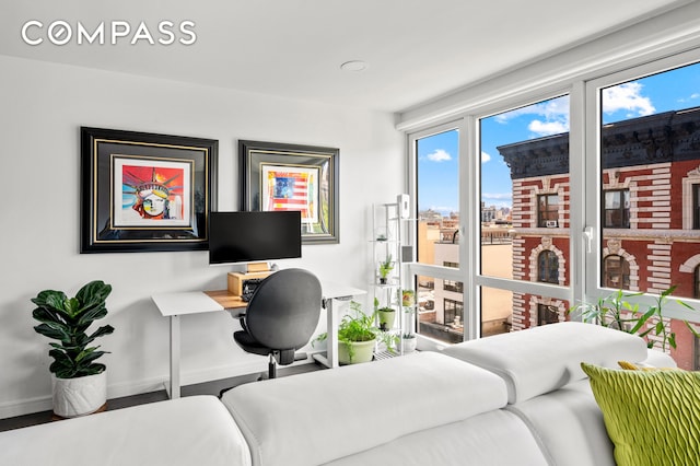 371 W 123rd St Unit 8A, New York City, NY 10027 - bedroom featuring baseboards and a desk