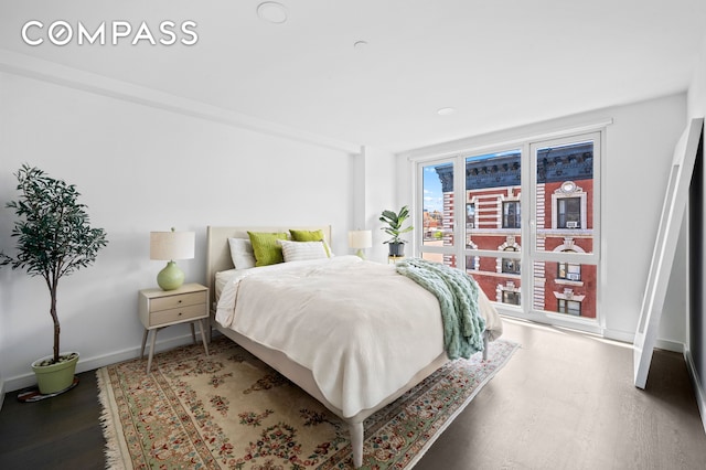 371 W 123rd St Unit 8A, New York City, NY 10027 - bedroom with wood finished floors and baseboards