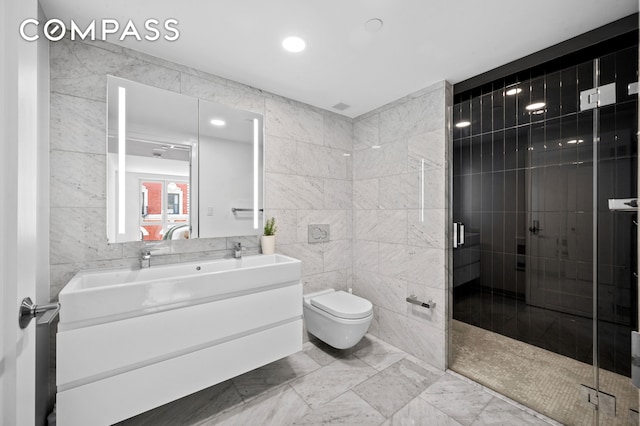 371 W 123rd St Unit 8A, New York City, NY 10027 - full bathroom featuring tile walls, vanity, toilet, a stall shower, and recessed lighting