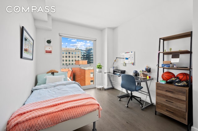 371 W 123rd St Unit 8A, New York City, NY 10027 - bedroom featuring dark wood-type flooring and baseboards