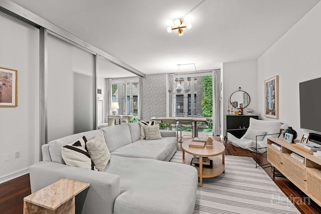 130 W 19th St Unit 4F, New York City, NY 10011 - living area featuring dark wood-type flooring and baseboards