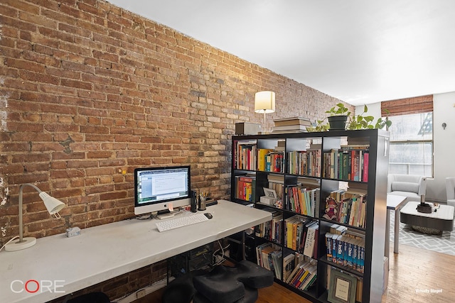 105 E 100th St Unit 4B, New York City, NY 10029 - home office featuring wood finished floors and brick wall