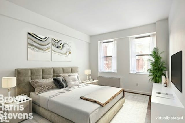27 W 19th St Unit 7, New York City, NY 10011 - bedroom featuring baseboards and wood finished floors