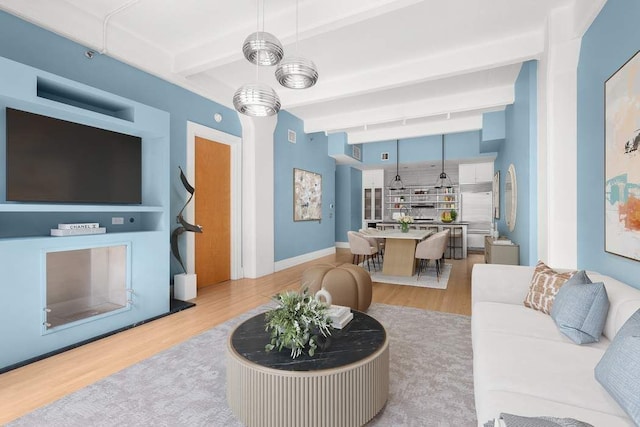 30 Main St Unit 2H, New York City, NY 11201 - living area featuring wood finished floors and beamed ceiling