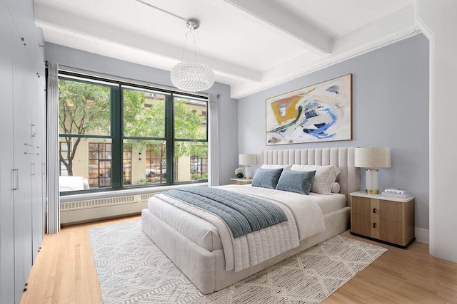 30 Main St Unit 2H, New York City, NY 11201 - bedroom featuring beamed ceiling and light wood-style flooring