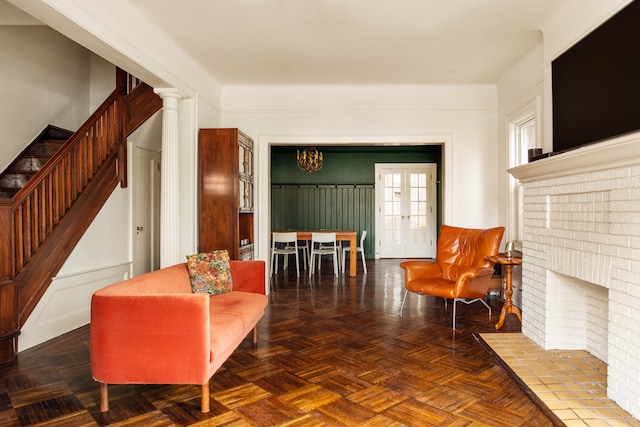 216 E 21st St, New York City, NY 11226 - living area featuring stairway and a chandelier