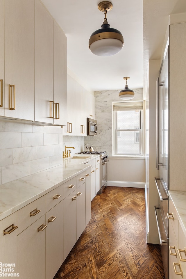 45 Sutton Pl S Unit 16/O, New York City, NY 10022 - kitchen with stainless steel appliances, a sink, tasteful backsplash, and light stone counters