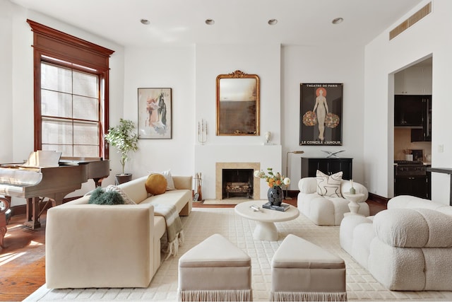 116 W 74th St, New York City, NY 10023 - living area with light wood-style floors, a fireplace, and recessed lighting
