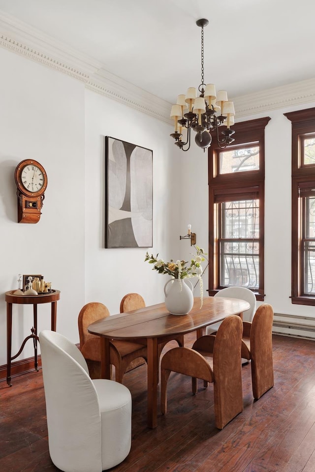 116 W 74th St, New York City, NY 10023 - dining space with a chandelier, dark wood-type flooring, and crown molding