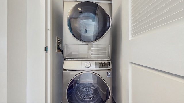 310 W 52nd St Unit 17A, New York City, NY 10019 - laundry area with stacked washer and clothes dryer