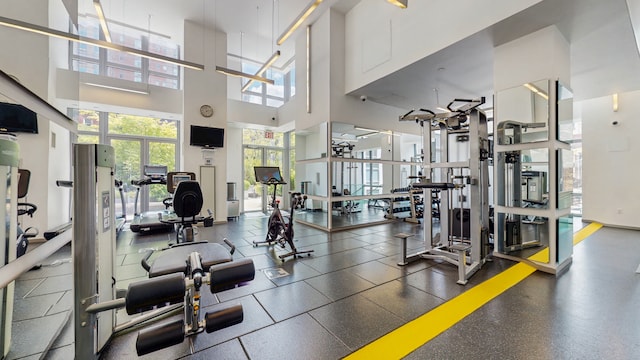 310 W 52nd St Unit 17A, New York City, NY 10019 - exercise room featuring a high ceiling