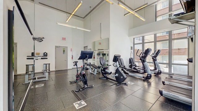 310 W 52nd St Unit 17A, New York City, NY 10019 - gym featuring a towering ceiling